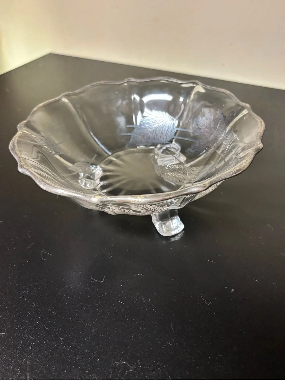 Vintage footed glass bowl featuring a silver overlay leaf motif, likely produced